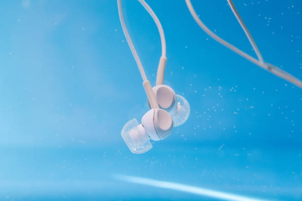 istock headphones in the water. Underwater, selective focus, musical concept 1256249234