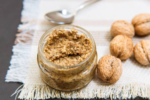 istock Raw organic walnut butter and fresh nuts. 1256249572