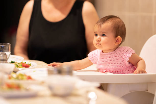 istock Parent feeding their little baby 1256251543