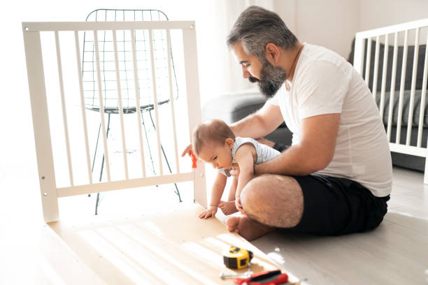 istock Father and his little daughter working at home 1256251724
