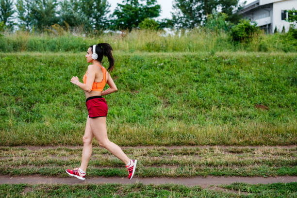 istock Sportswoman running in nature 1256253741