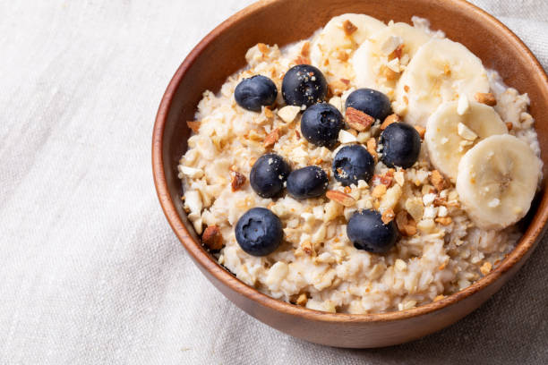 istock oatmeal with bananas, blueberries and almonds. 1256255135