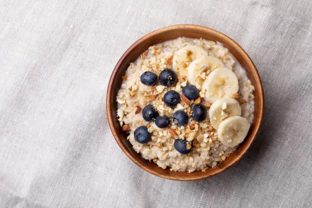 oatmeal with bananas, blueberries and almonds.Vegan food.