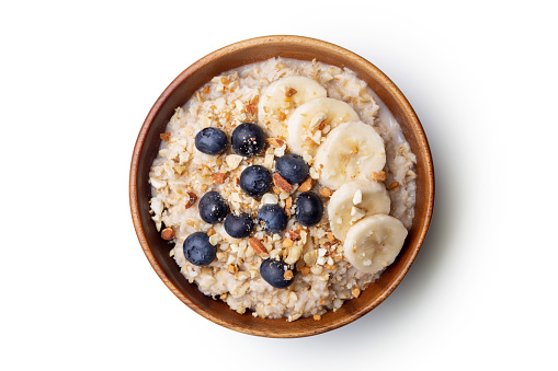 oatmeal with bananas, blueberries and almonds.Vegan food. with clipping path.