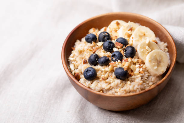 istock oatmeal with bananas, blueberries and almonds. 1256255143