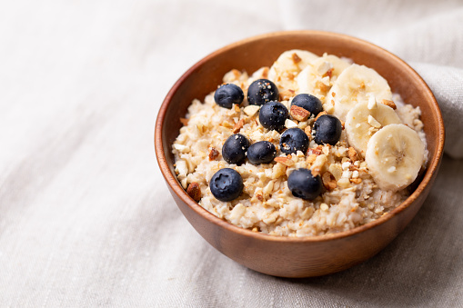 oatmeal with bananas, blueberries and almonds.Vegan food.