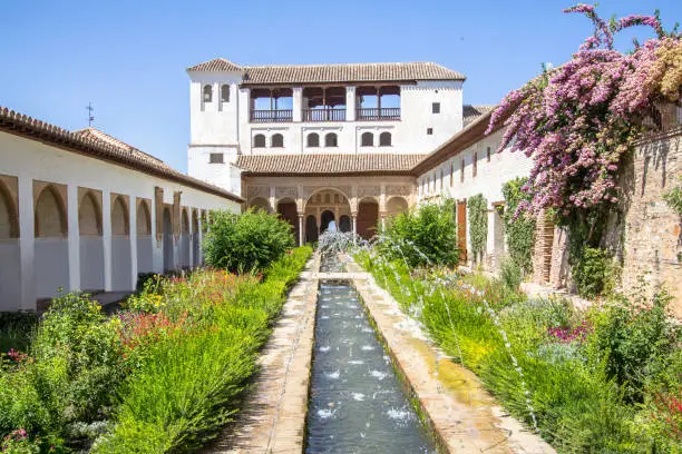 Garden and fountain in patio de la Acequia La Alhambra, Granada, Andalucia, Spain