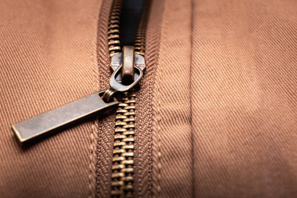istock Close up of brown jeans zipper 1256256084