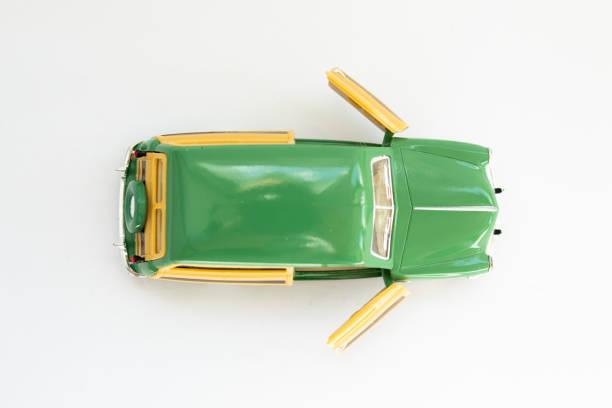 istock classic toy car on a white background 1256257131