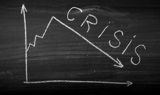 Stock market crisis concept on blackboard
