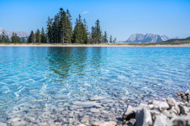 istock Mountain lake landscape view 1256257360
