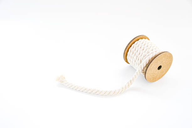 istock Cotton roll yellow white string object on white background, Natural white Shabby Style Rustic String Twine Shank Craft,string use for tight things together and creative idea for hobby.  space for text 1256259309