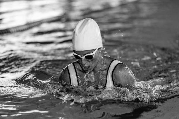 istock Woman Swimming In Pool 1256259417