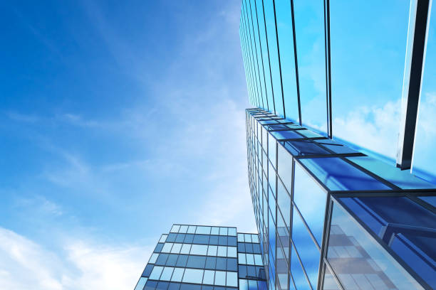 istock Abstract futuristic architecture, Skyscraper glass office building. 3D render. 1256259877