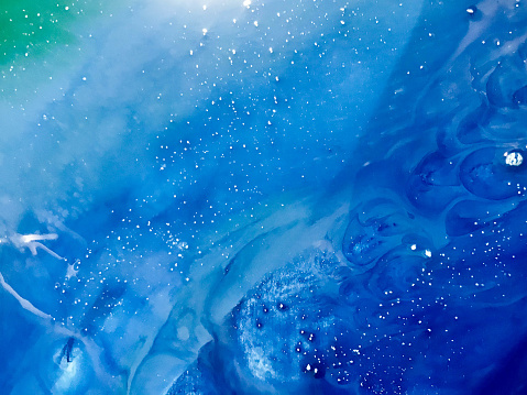 green-blue sea wave with epoxy bubbles. Abstract background on a wooden mold with a marine theme. themes of the underwater world and the ocean on canvas, shot from above.
