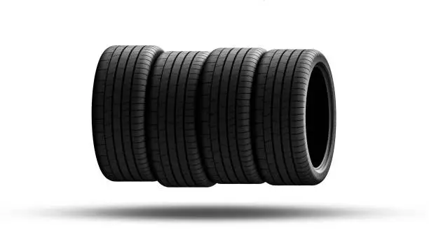 Pile of tires on white background. Automotive Components. New performance car tire.