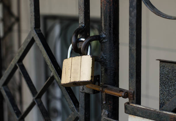 istock Old padlock. A padlock hangs on the railing. Rusty metal. 1256265139