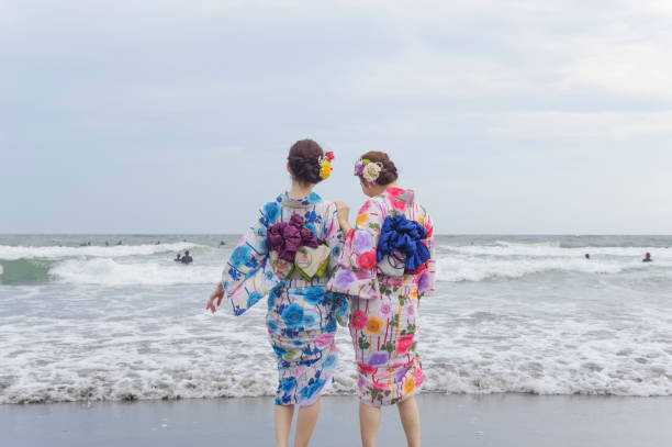 Woman in yukata Two women in yukata playing on the beach shonan photos stock pictures, royalty-free photos & images