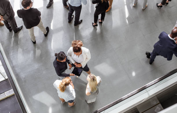 istock Business people discussing in the hallway 1256265505