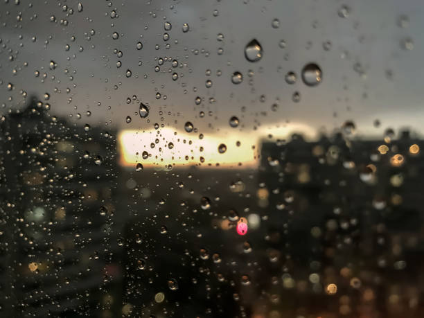 istock Background drops of water. Raindrop on window panes 1256265512