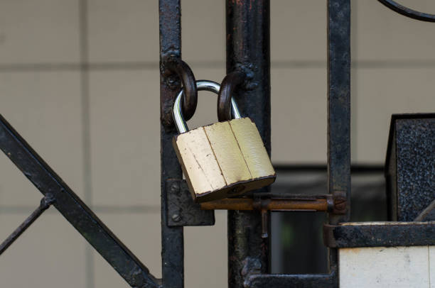 istock Iron gate. Steel door. Padlock. Metal grid. 1256265574