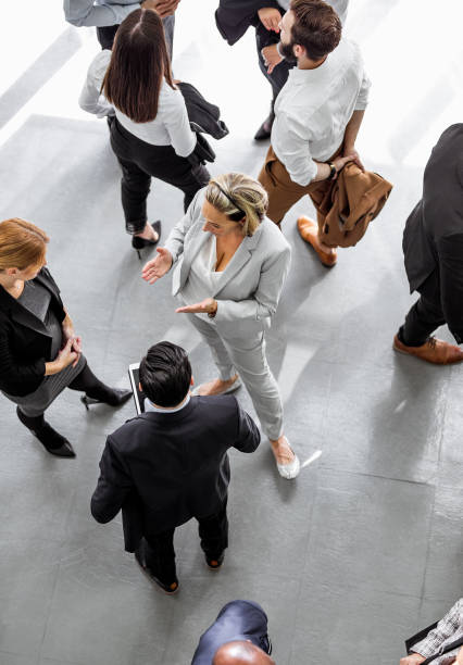 istock Business people discussing in the hallway 1256266883