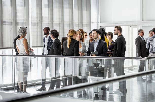 istock Business people discussing in the hallway 1256267004