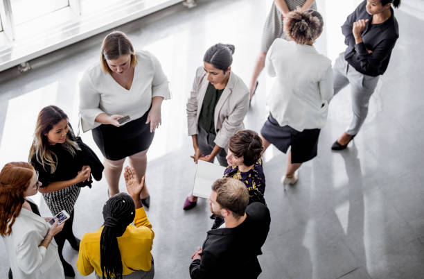 istock Business people discussing in the hallway 1256268400