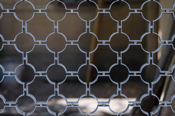 Metal fence. Shod lattice. Curly latte.