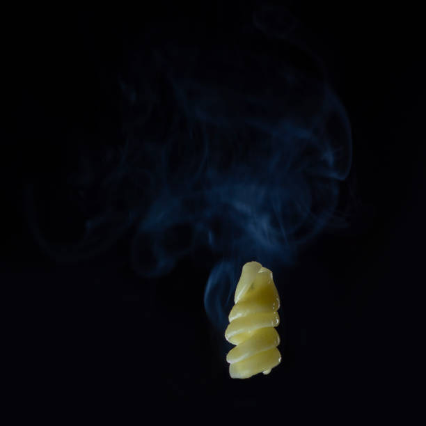 istock Hot cooked macaroni over a dark background with steam 1256268471