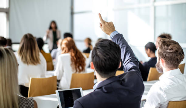 istock Business people at a conference 1256268567