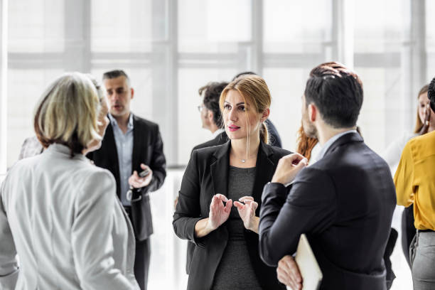 istock Business people discussing in the hallway 1256269812