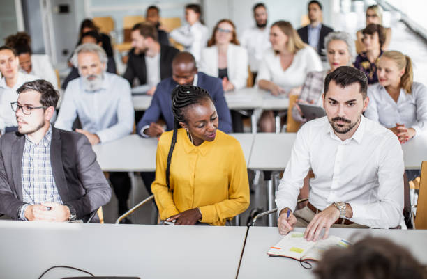 istock Business people at a conference 1256270924