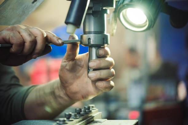 istock The worker is working with vertical metal milling machine 1256275454