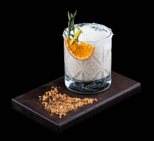 Exquisite original cocktails on a black background. Orange, cream