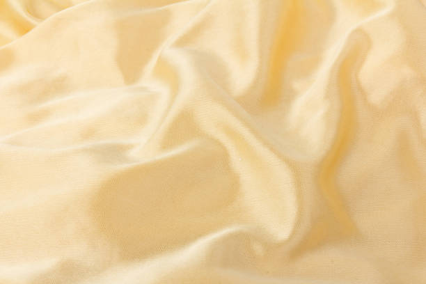 istock Smooth elegant golden silk or satin luxury cloth texture can use as wedding background. Luxurious background design.  Retro style 1256277545
