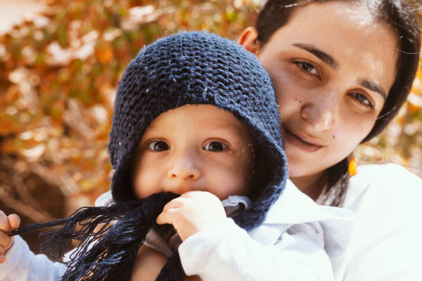 Mother holding cute sweet son
