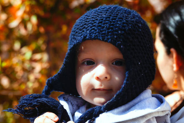 istock Mother holding cute sweet son 1256279365