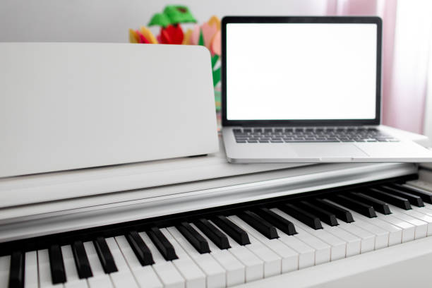 istock a white piano with a laptop on it. remote training, online education 1256279891
