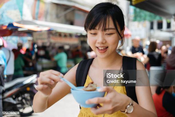 Young Asian Female Tourist Enjoying Shaved Ice Dessert Cendol At Street Stock Photo - Download Image Now