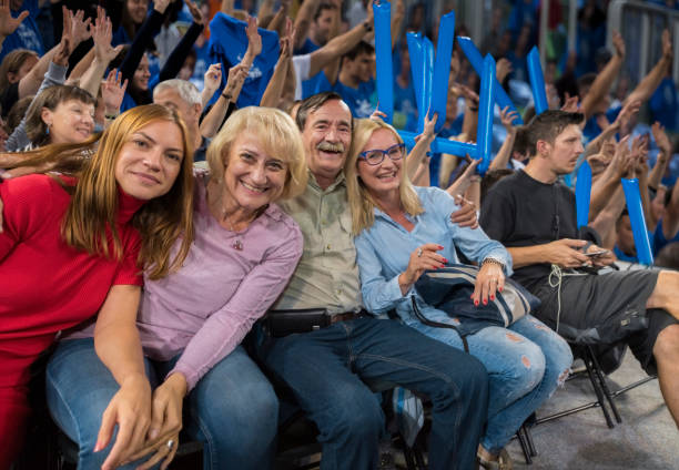 istock Smiling family sitting in stadium 1256281343