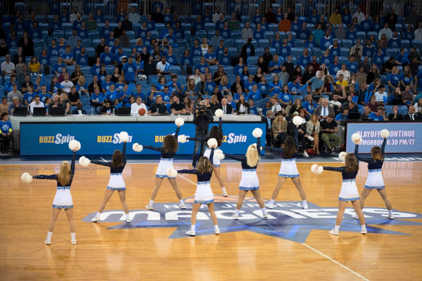 istock Cheerleaders performing in court 1256281367