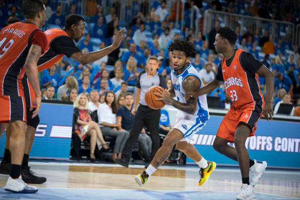 istock Basketball player trying to block opposite team player 1256281371