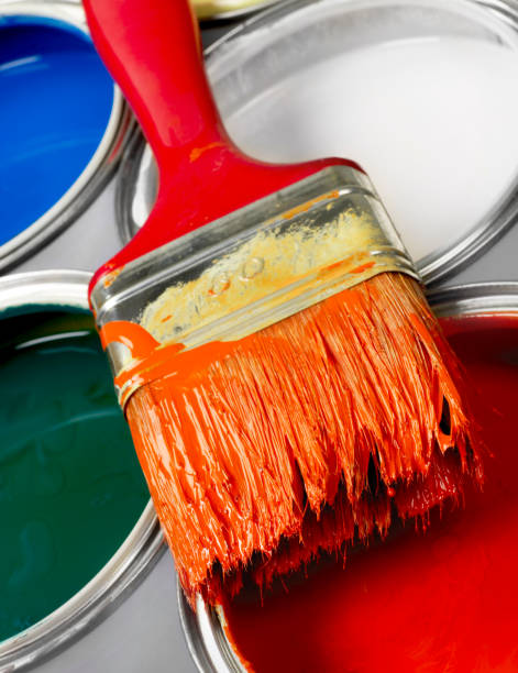 istock Paint brush and paint cans 1256281573
