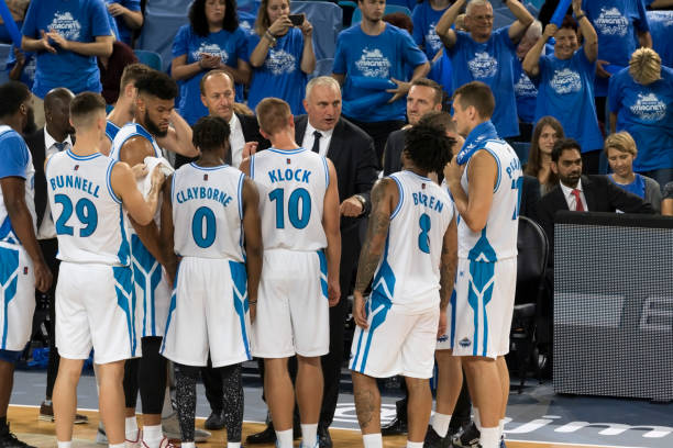 istock Coach giving instructions to basketball team 1256281645
