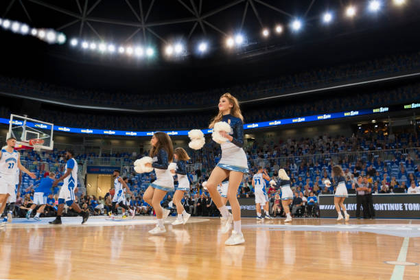 istock Cheerleaders performing in court 1256281647