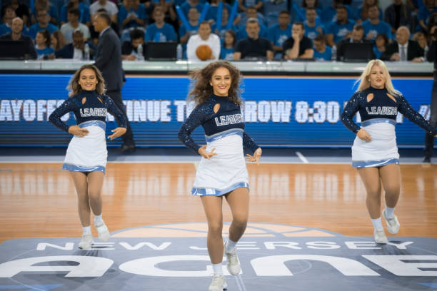 istock Cheerleaders performing on court 1256281706