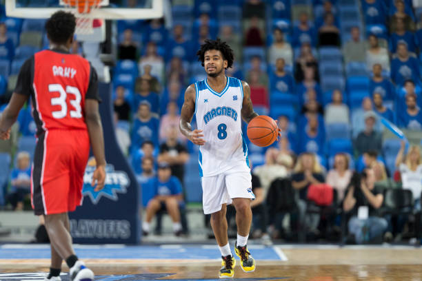 istock Basketball players playing on court 1256281763