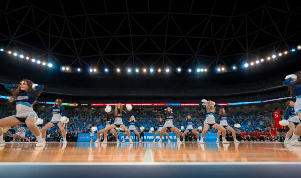 istock Cheerleaders performing in court 1256281793