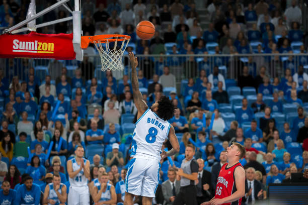 istock Basketball player aiming hoop 1256281806